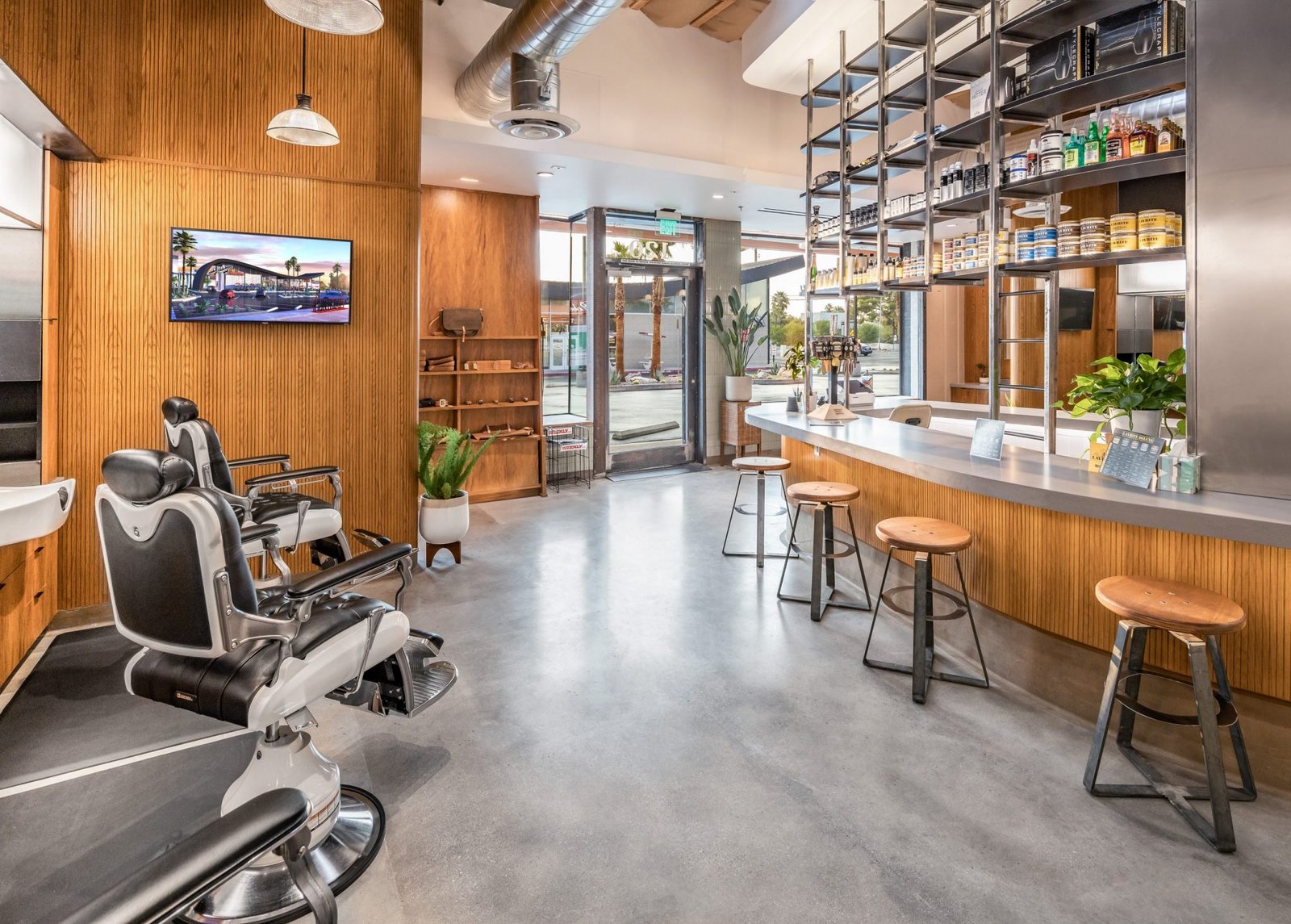 Looking down the length of the shop, chairs on one side and the bar on the other